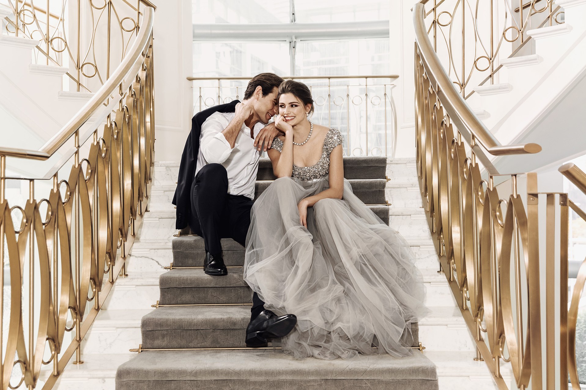 A couple on the grand staircase at Address Boulevard
