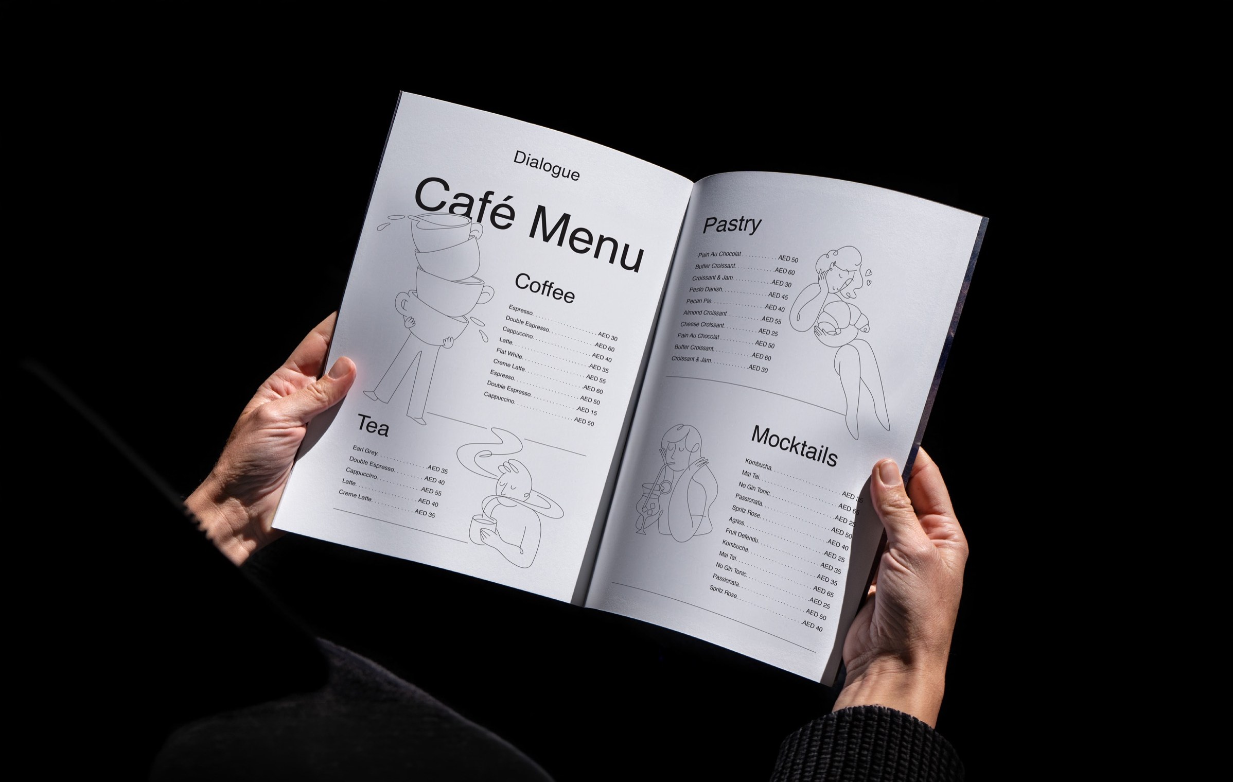 The Dialogue café menu, held open