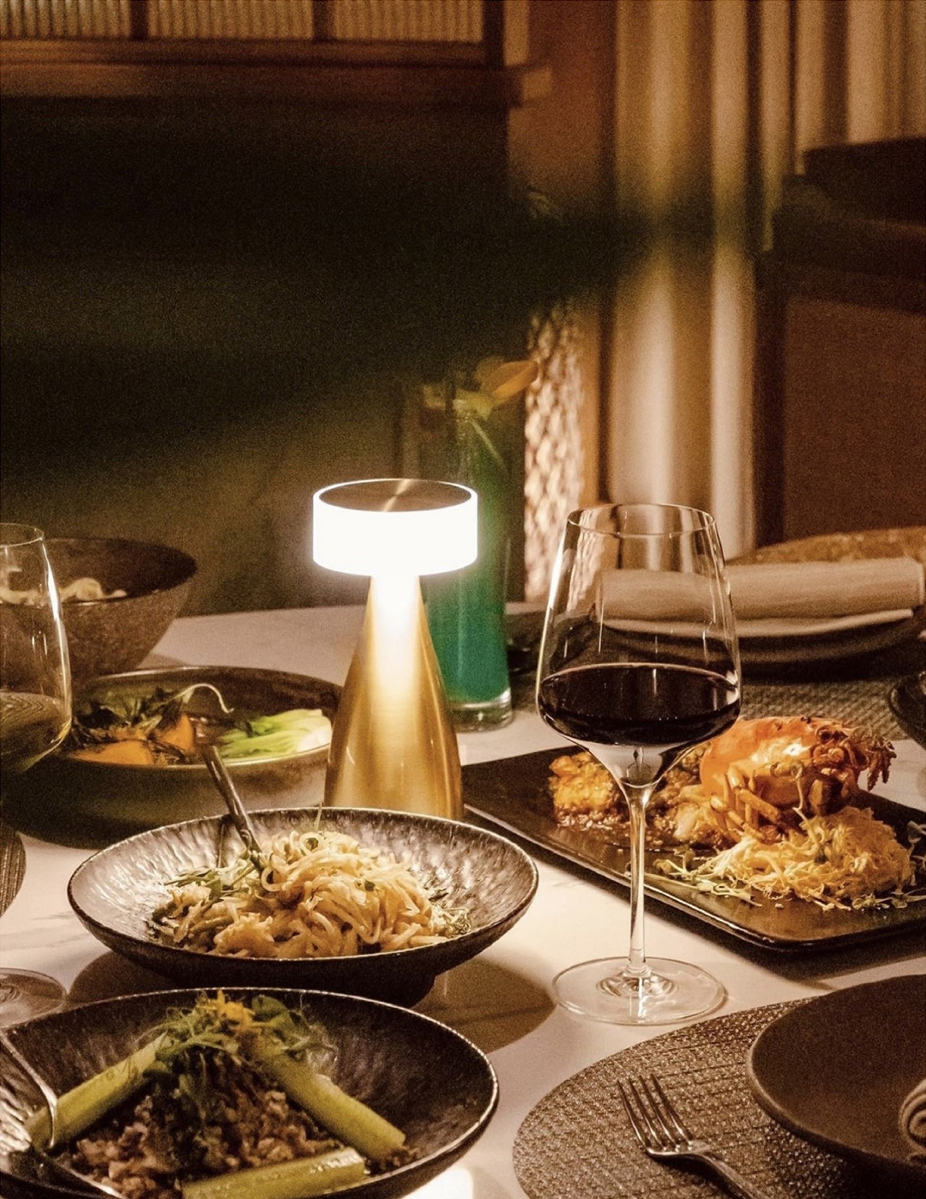 A Thiptara table setting at night